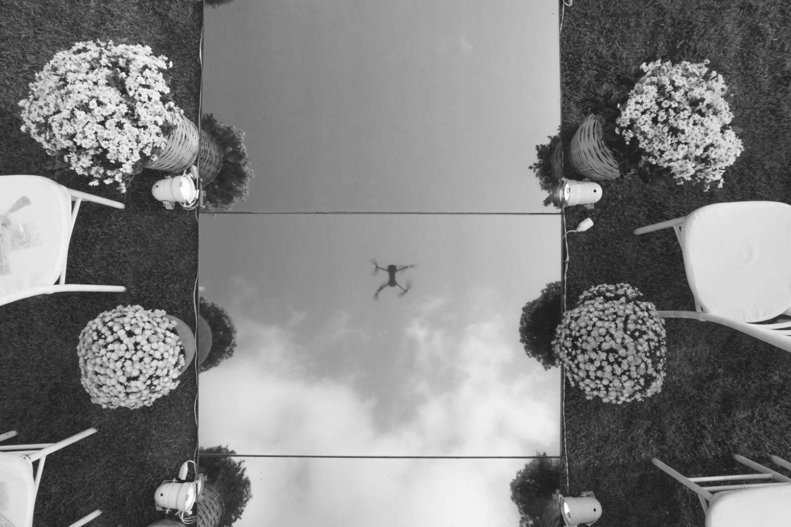 Artisan arranging seasonal flowers in traditional basket weaving technique